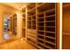 Large walk-in closet with custom shelving, drawers, and a full-length mirror at 8966 Easterling Dr, Orlando, FL 32819