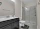 Bathroom showcasing a vanity with a white countertop and glass enclosed shower at 8995 Croquet Ct, Champions Gate, FL 33896