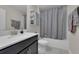 Bathroom featuring gray tones, a gray shower curtain, and neutral walls at 8995 Croquet Ct, Champions Gate, FL 33896