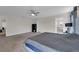 Neutral bedroom featuring a view into the en suite bathroom, and large windows at 8995 Croquet Ct, Champions Gate, FL 33896