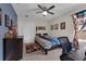 Bedroom featuring neutral carpet, sports decor, and a ceiling fan at 8995 Croquet Ct, Champions Gate, FL 33896