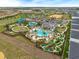 Aerial view of the community pool and recreation area including waterslides, mini-golf, and outdoor bar at 8995 Croquet Ct, Champions Gate, FL 33896