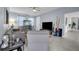 Bright and airy living room with contemporary furnishings and neutral decor at 8995 Croquet Ct, Champions Gate, FL 33896