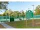 Community tennis court for residents with posted rules and regulations at 105 Pine Street, Windermere, FL 34786