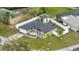 An aerial view shows a well-maintained property featuring a new roof and fully fenced yard at 112 Lake Butler Ave, Haines City, FL 33844