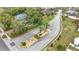 High angle aerial view of the neighborhood sign in a landscaped median at 112 Lake Butler Ave, Haines City, FL 33844