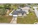 Aerial view of a charming home with a two-car garage, neutral paint and a fenced yard at 112 Lake Butler Ave, Haines City, FL 33844