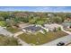 Aerial view showcasing the property and its fenced yard within the surrounding neighborhood at 112 Lake Butler Ave, Haines City, FL 33844