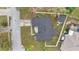 Aerial view of a home featuring new roof and fenced yard; showcases landscaping and neighborhood setting at 112 Lake Butler Ave, Haines City, FL 33844