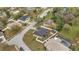Aerial view of the property in a residential area, showcasing its new roof and fenced yard at 112 Lake Butler Ave, Haines City, FL 33844
