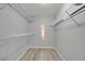 Walk-in closet with metal shelving and ample storage space at 112 Lake Butler Ave, Haines City, FL 33844