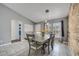 Charming dining room with wood accent wall and natural light coming through windows at 112 Lake Butler Ave, Haines City, FL 33844
