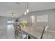 Dining area with tile floors adjacent to a living area and patio access at 112 Lake Butler Ave, Haines City, FL 33844