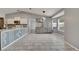 Open kitchen and dining area featuring gray color palette, unique island design, and ample natural light at 112 Lake Butler Ave, Haines City, FL 33844
