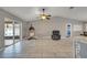 Spacious open living area with vaulted ceiling and patio access with lots of natural light at 112 Lake Butler Ave, Haines City, FL 33844