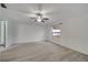 Spacious main bedroom with ceiling fan, neutral walls, and wood-look flooring at 112 Lake Butler Ave, Haines City, FL 33844