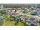 Aerial view of neighborhood showcasing homes, pools, and lush green space at 13537 Ivy Brooke Ln, Orlando, FL 32828