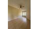 A bright bedroom featuring tile floors, a ceiling fan, and a window letting in natural light at 13900 Corrine Key Pl, Orlando, FL 32824