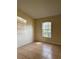 Bedroom with a single window providing natural light and tile flooring at 13900 Corrine Key Pl, Orlando, FL 32824