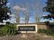 Community entrance sign for Keystone set against a brick wall and lush landscaping at 13900 Corrine Key Pl, Orlando, FL 32824