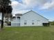 View of a house's exterior showing lawn and stucco wall at 13900 Corrine Key Pl, Orlando, FL 32824