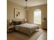 Bedroom with neutral decor, tiled floors, arched window, and ample lighting at 13900 Corrine Key Pl, Orlando, FL 32824