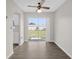 Dining area filled with natural light from sliding glass doors and stylish ceiling fan at 15003 Sw 43Rd Terrace Rd, Ocala, FL 34473