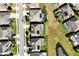 An aerial shot showing roof and backyard swimming pools of several well-manicured homes at 15165 Heron Hideaway Cir, Winter Garden, FL 34787