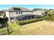 Aerial view of a private backyard with a well-maintained lawn and screened-in porch at 15165 Heron Hideaway Cir, Winter Garden, FL 34787