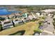 A residential area shows a great view of the neighborhood, with similar two-story homes, swimming pools, and a pond at 15165 Heron Hideaway Cir, Winter Garden, FL 34787
