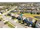 A lovely residential street shows a great view of the neighborhood, with similar two-story homes and well-kept lawns at 15165 Heron Hideaway Cir, Winter Garden, FL 34787