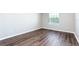 Inviting bedroom showcasing wood-look floors, bright natural light, and neutral walls at 15165 Heron Hideaway Cir, Winter Garden, FL 34787