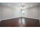 This bedroom has hardwood floors, neutral walls and two windows to provide natural light at 15165 Heron Hideaway Cir, Winter Garden, FL 34787