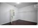 Spacious walk-in closet with custom shelving and dark hardwood floors, perfect for organization at 15165 Heron Hideaway Cir, Winter Garden, FL 34787