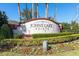 Community entrance sign with manicured landscaping reading 'Johns Lake Pointe' at 15165 Heron Hideaway Cir, Winter Garden, FL 34787