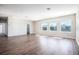 Spacious living room with wood floors, bright windows, and a walk in closet at 15165 Heron Hideaway Cir, Winter Garden, FL 34787