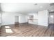 Upstairs living room featuring wood floors and a staircase with wooden banister at 15165 Heron Hideaway Cir, Winter Garden, FL 34787