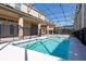 A covered pool area with a screened enclosure offers a relaxing outdoor retreat at 15165 Heron Hideaway Cir, Winter Garden, FL 34787