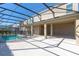A covered pool area with columns and a screened enclosure offers a relaxing outdoor retreat at 15165 Heron Hideaway Cir, Winter Garden, FL 34787