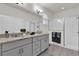 Bathroom features a double sink, granite counters, a tiled floor and glass shower at 15914 Moonlight Bay St, Winter Garden, FL 34787