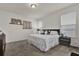 Bedroom with carpet, a queen bed, and decor above the bed at 15914 Moonlight Bay St, Winter Garden, FL 34787