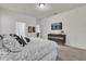 Comfortable bedroom featuring carpet, a tv and dresser in a neutrally painted living space at 15914 Moonlight Bay St, Winter Garden, FL 34787