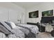 Bedroom featuring two TVs, carpet, and a bed with decorative pillows at 15914 Moonlight Bay St, Winter Garden, FL 34787