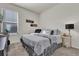 Bedroom with carpet, a window, and decor above the bed at 15914 Moonlight Bay St, Winter Garden, FL 34787