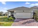 Charming home boasts a wide driveway, two-car garage and manicured landscaping at 15914 Moonlight Bay St, Winter Garden, FL 34787