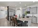 Modern kitchen features granite counters, a center island, stainless steel appliances and pantry at 15914 Moonlight Bay St, Winter Garden, FL 34787