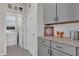 Convenient laundry room with modern appliances, sleek cabinets, and granite countertops at 15914 Moonlight Bay St, Winter Garden, FL 34787