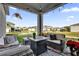 Inviting outdoor patio area with stylish seating and a cozy fire pit at 15914 Moonlight Bay St, Winter Garden, FL 34787
