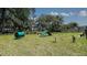 Community dog park includes play structures and seating, providing an engaging space for pets to enjoy at 171 River Front Way, Edgewater, FL 32141