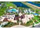 Stunning aerial view of the community's luxurious resort-style amenities including a large pool, splash park, lake, and clubhouse at 1731 Caribbean View Ter, Kissimmee, FL 34747